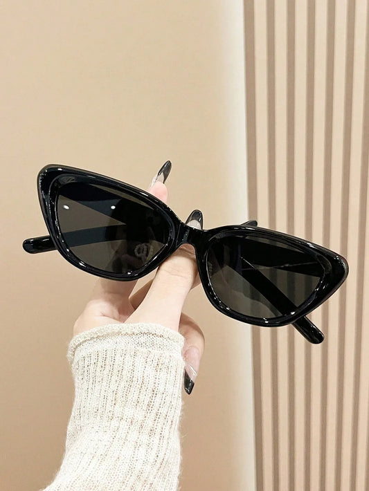 SHEIN-A pair of black frame cat-eye sunglasses for men and women - alotasawkli