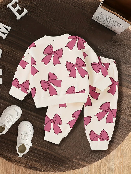 A Cute Cartoon Long-Sleeve Top with a Bow Pattern And Matching Long Pants Set for Baby Girls, Perfect for Outdoor Wear. - alotasawkli
