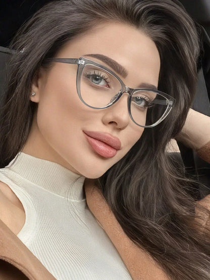 SHEIN-A pair of black cat-eye sunglasses with a polycarbonate frame - alotasawkli