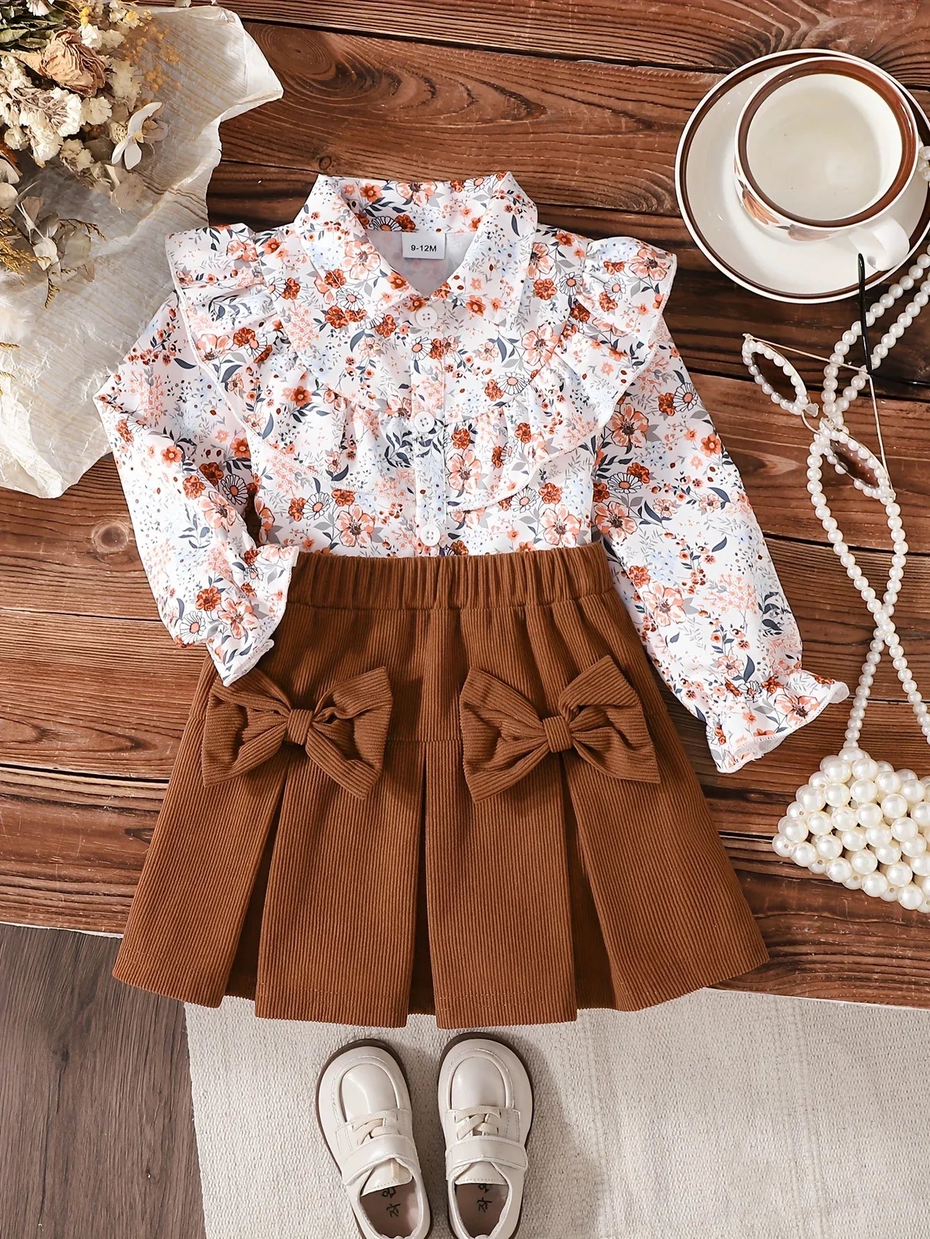 A Cute Outfit for Girls Featuring a Long-Sleeve Top with a Floral Print, Button- Collar, And Ruffled Design, Perfect for Spring And Autumn, Paired with a Khaki Bow Short Skirt, for Outdoor - alotasawkli