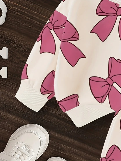 A Cute Cartoon Long-Sleeve Top with a Bow Pattern And Matching Long Pants Set for Baby Girls, Perfect for Outdoor Wear. - alotasawkli