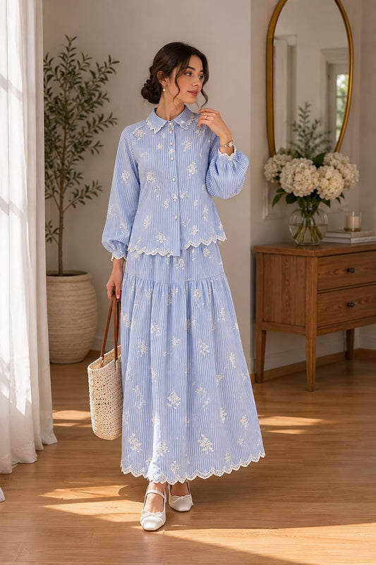 A blue set embroidered with elegant feminine details